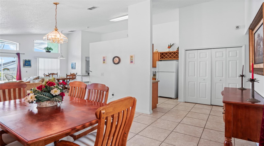 A view from the dining room to the laundry area and into the kitchen.