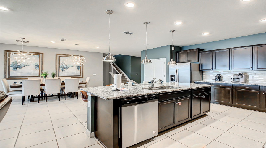 Kitchen--Enjoy the open-concept kitchen and dining area, perfect for cooking sharing