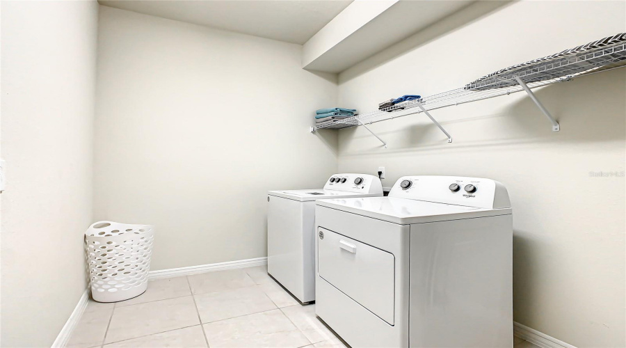 Laundry room--with washer, dryer, and built-in shelving Bright, Clean, and Functional