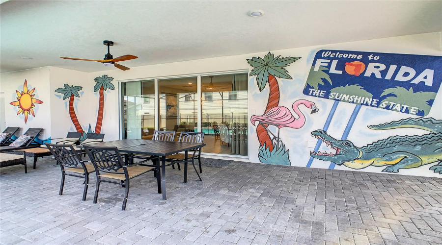 Backyard--Enjoy dining and lounging right by the pool
