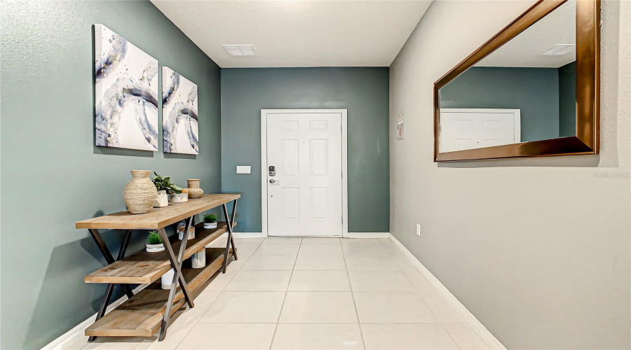Foyer--Bright and welcoming entryway featuring neutral tones stylish wall art