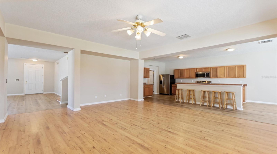 Family room view showing Kitchen and open to living and dining room