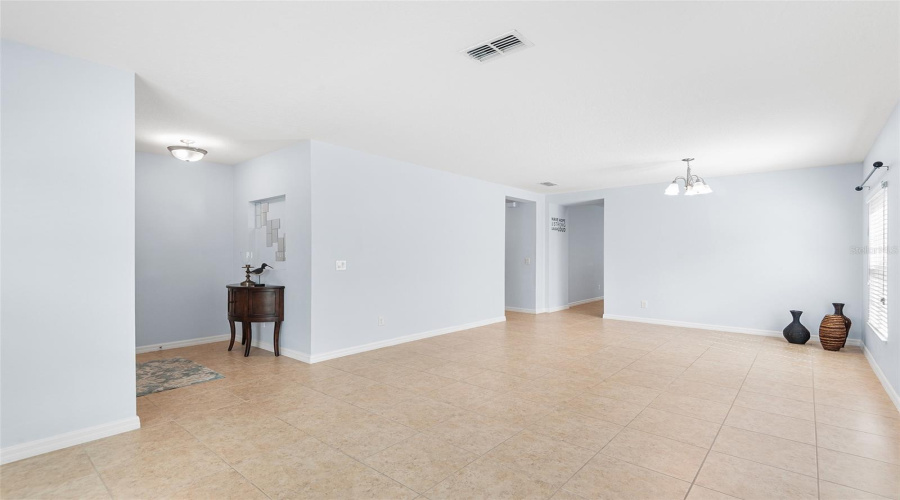VIEW TOWARDS FRONT ENTRY, LIVING ROOM & DINING ROOM