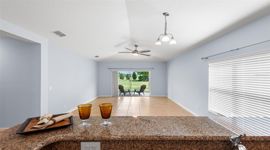 VIEW FROM KITCHWN TOWARDS GREAT ROOM/FAMILY ROOM & LANAI
