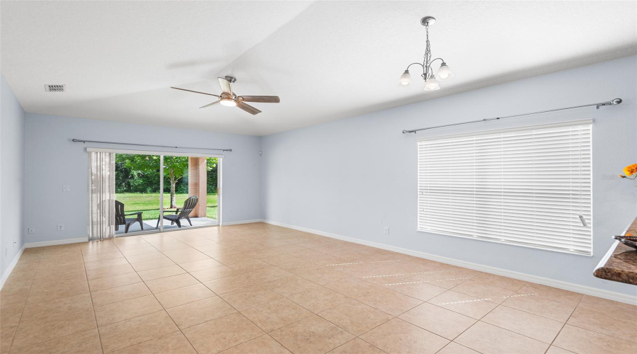 GREAT ROOM/ FAMILY ROOM IS SPACIOUS & FEATURES VAULTED CEILING
