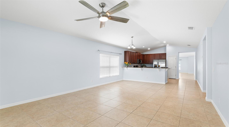 VIEW TOWARDS KITCHEN FROM SLIDING GLASS DOOR IN GREAT ROOM/FAMILY ROOM
