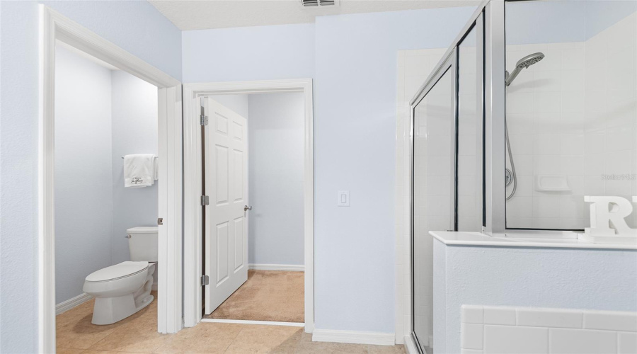 ENSUITE BATH WITH GLASSED IN SHOWER &  WATER CLOSET