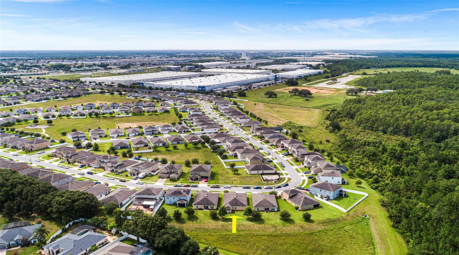 AERIAL VIEW OF HOME & SURROUNDING AREA. VIEW TOWARDS SOUTHEAST