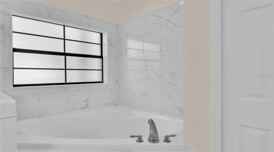 Master bath with comfortable tub (new tile).