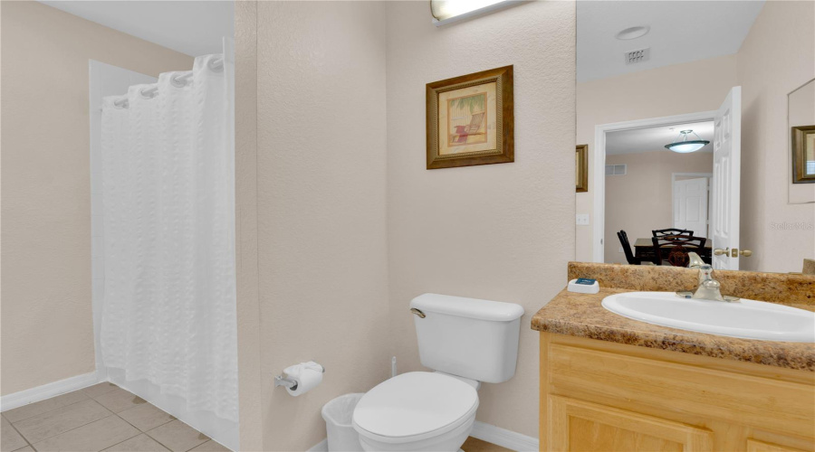 Bathroom #2, with access to dinning area and convenient second door to bedroom.