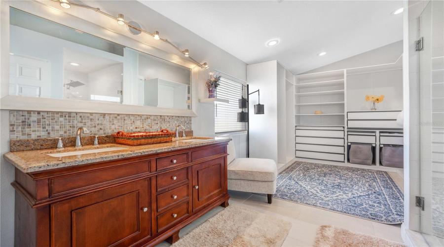 Primary Ensuite connects to custom built in closets