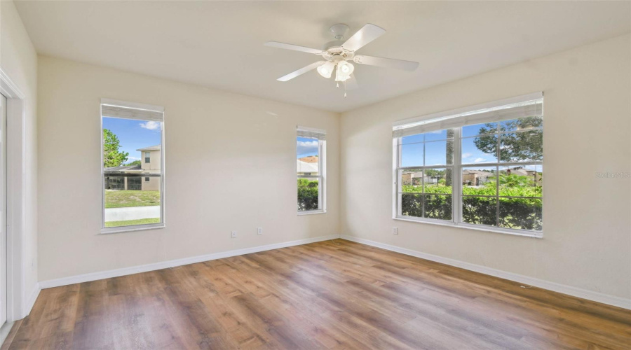 The main-floor primary suite features brand new hardwood flooring, a large ensuite bathroom with dual sinks, a garden tub, walk-in shower, and a private water closet.