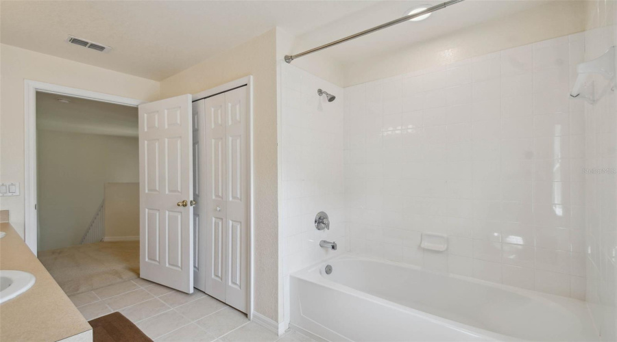 Upstairs full bathroom with tub/shower combo.