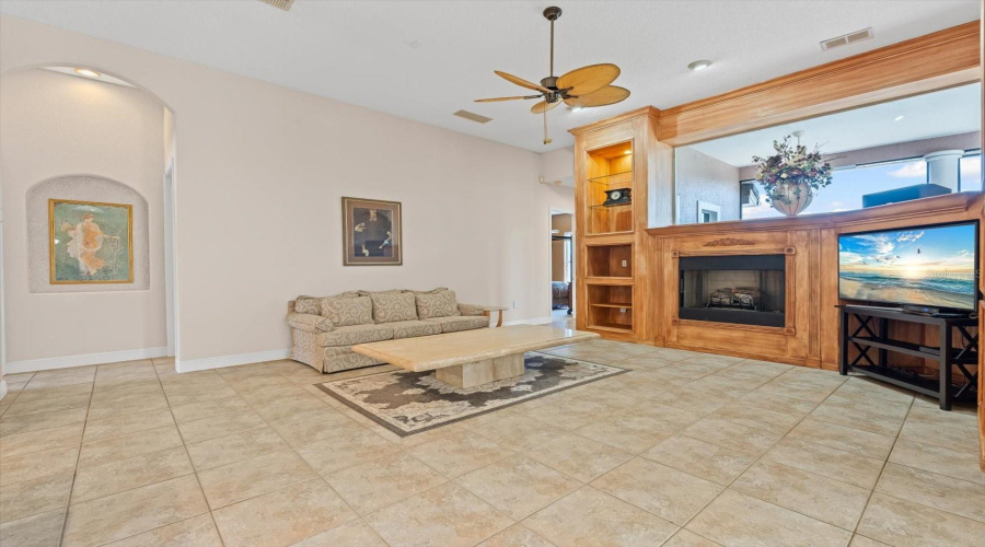 Family Room w/ Custom Cabinetry, Gas Fireplace, Surround sound with Subwoofer and Speakers