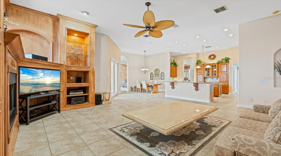Family Room w/ Custom Cabinetry, Gas Fireplace, Surround sound with Subwoofer and Speakers