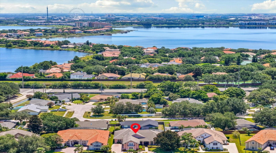West view of Big Sand Lake and International Drive Hotels and Attractions including the Orlando Eye @ ICON Park