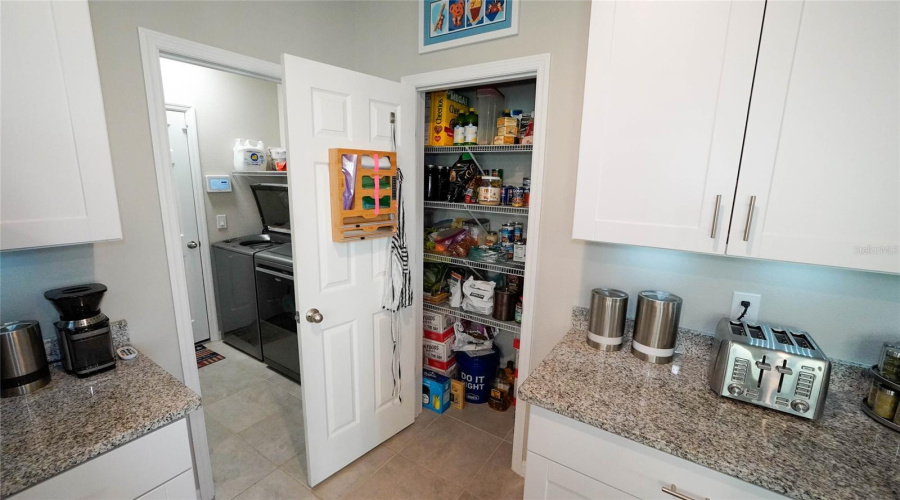 Large pantry for additional storage and laundry area just off the kitchen.