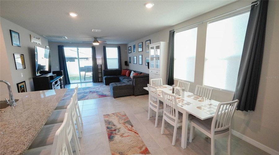 The open living area is perfect for any lifestyle!  Large sliding doors lead out to patio and fully fenced large back yard.