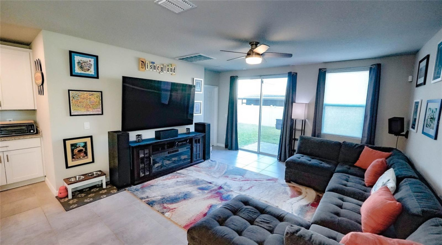 The living room area is large, yet cozy.