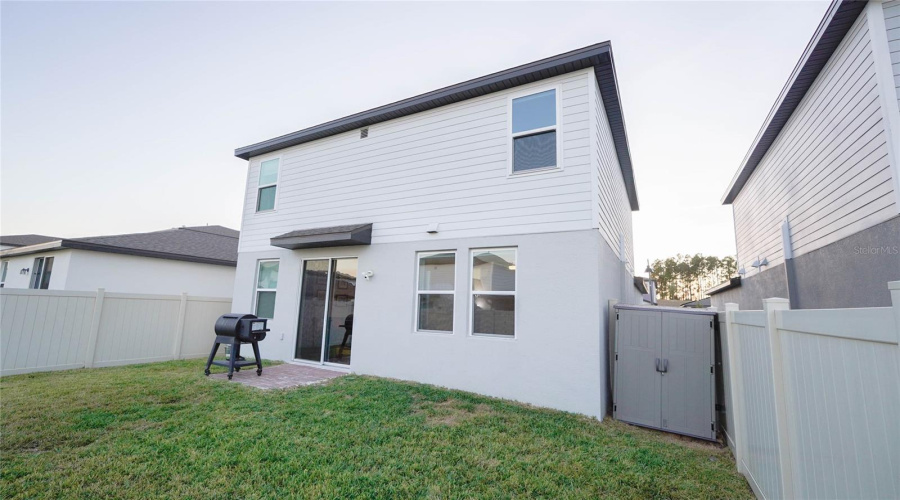 There is even a storage shed tucked away in the back yard for your extra outdoor items.