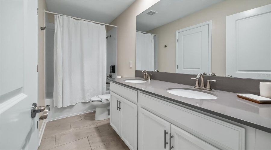 Bathroom 3 double vanity and tub with shower