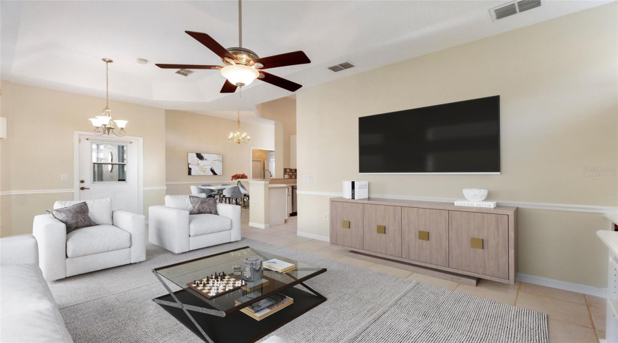 Virtually staged family room and great room dining area