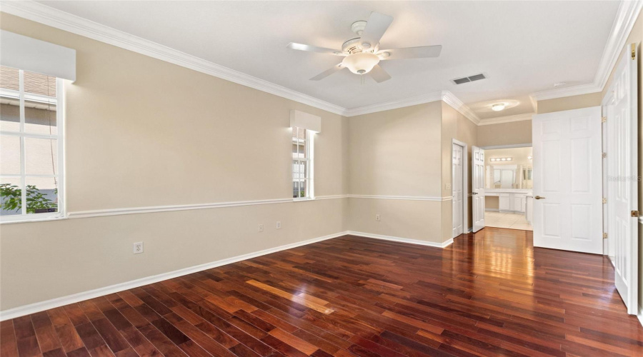 Primary en suite bedroom has walk-in and built in closets