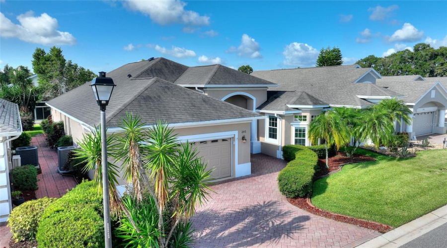 Expanded brick paver driveway extends to front door