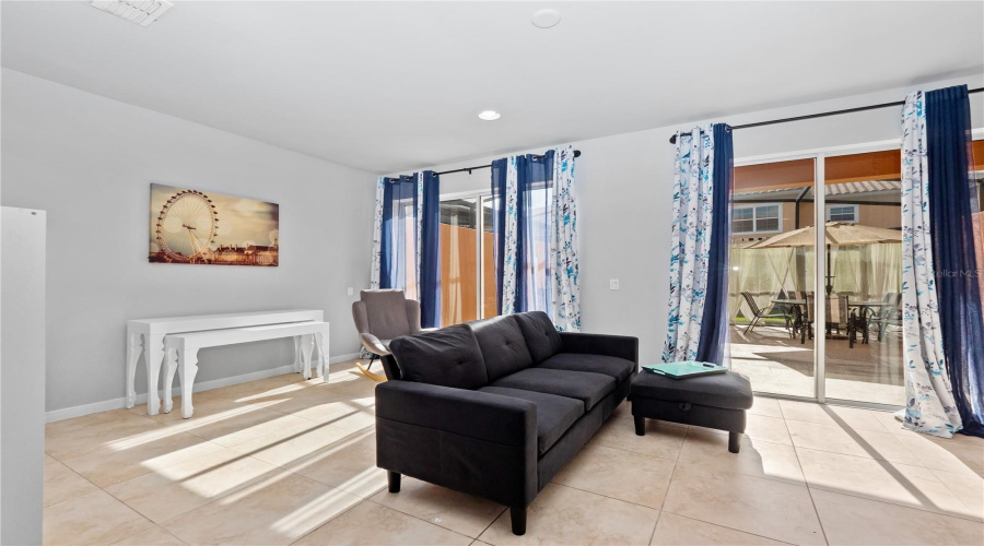 Spacious Living Room Opens to a Large Courtyard Patio with Hot Tub