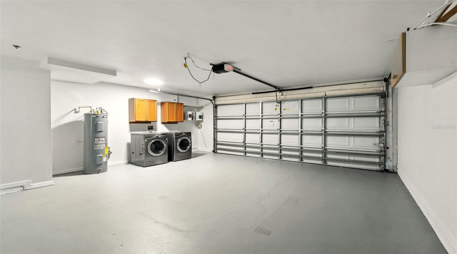 Newly painted garage walls and floor, new water heater and plumbing, laundry