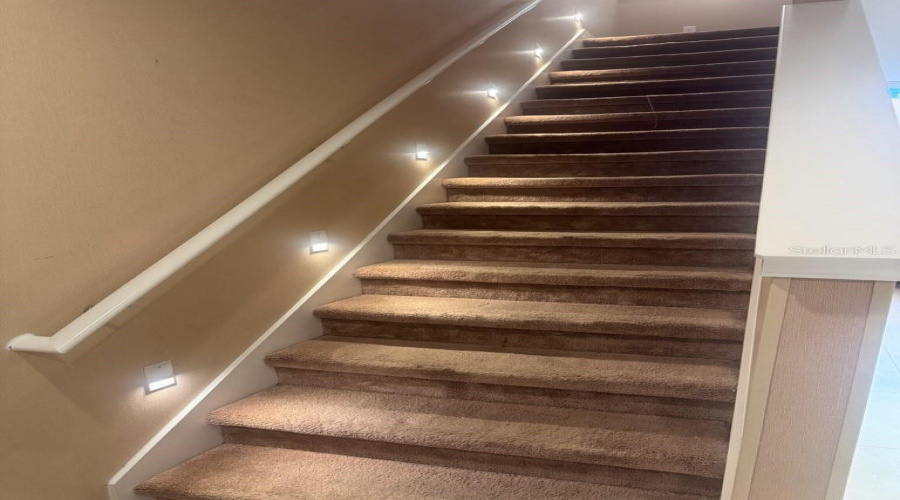 Stairs to second Floor with designer lighting