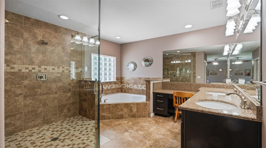 The owner’s en-suite is a serene, spacious retreat featuring a garden tub for relaxing soaks and a separate walk-in shower—thoughtfully designed for comfort and everyday luxury.