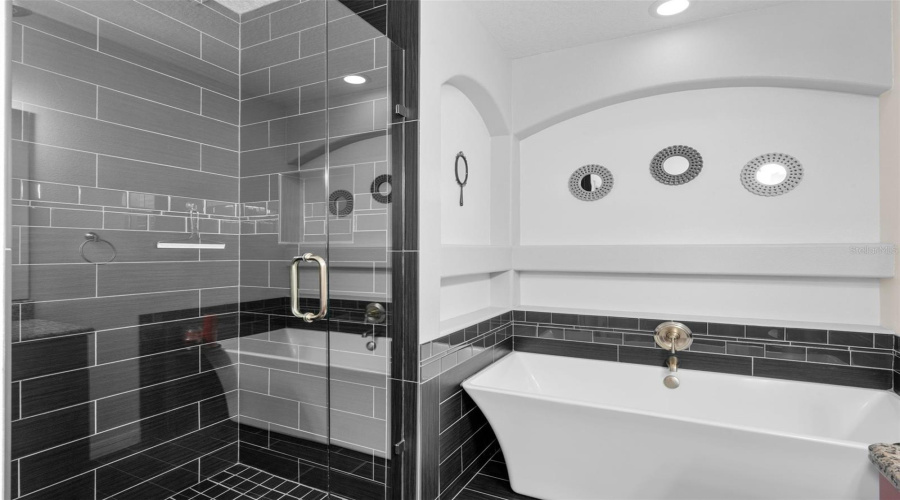 Experience ultimate relaxation in the updated shower and  tub—your personal spa-like retreat designed for comfort and serenity