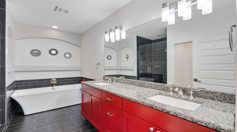 Experience ultimate relaxation in the updated shower and  tub—your personal spa-like retreat designed for comfort and serenity