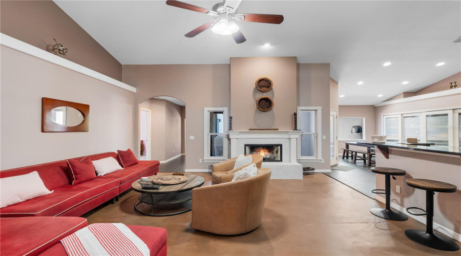 Home is where love resides, memories are made, and the living room becomes the heart of it all. With a cozy fireplace and easy kitchen access, this space invites you to gather, laugh, and entertain—Southern style.