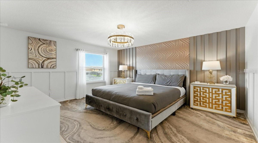 Stylish upstairs retreat that gives guests space, comfort, and their own bathroom.