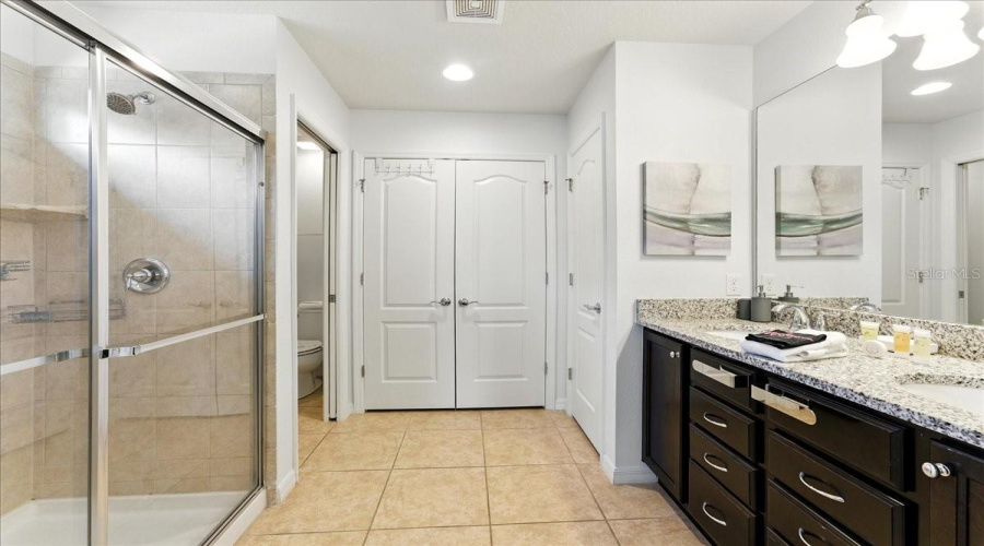 Double vanity, walk-in shower, and space to actually unpack.