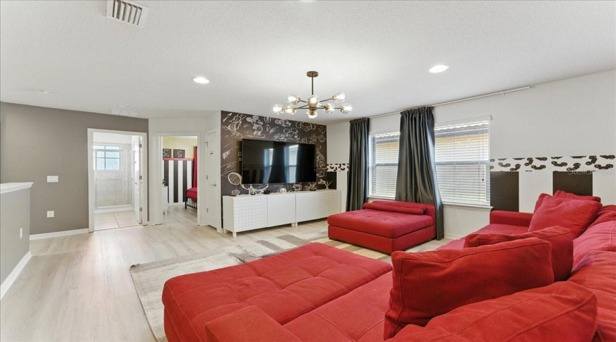 Loft lounge with plenty of space to pile in for movie nights or game days.