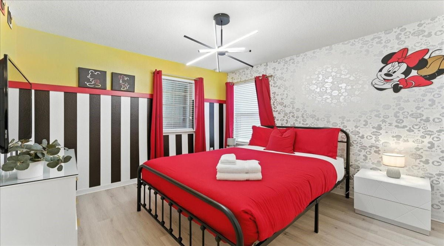 Minnie-themed room that keeps guests happy and coming back with Jack and Jill bathroom.