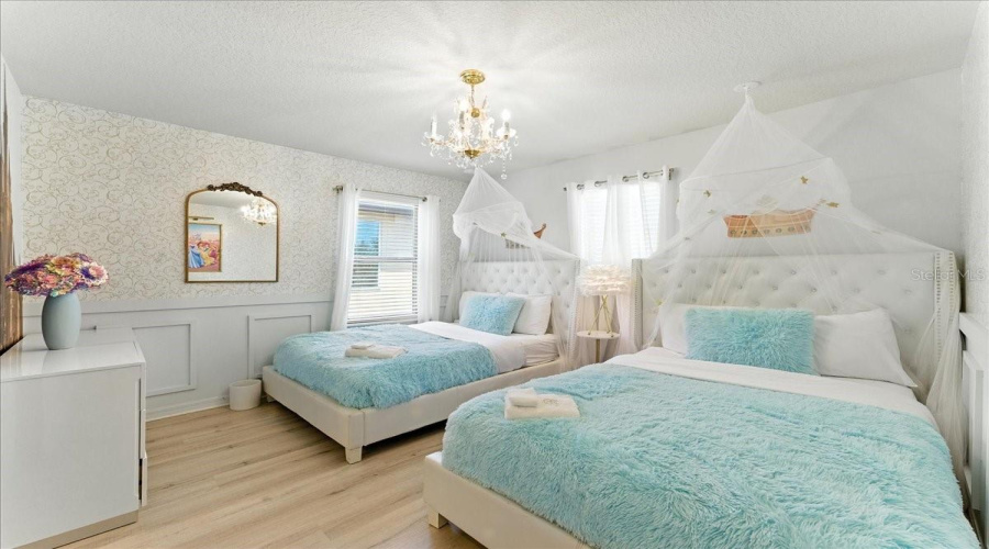 Fairy-tale twin room built for sleepovers and big imaginations.