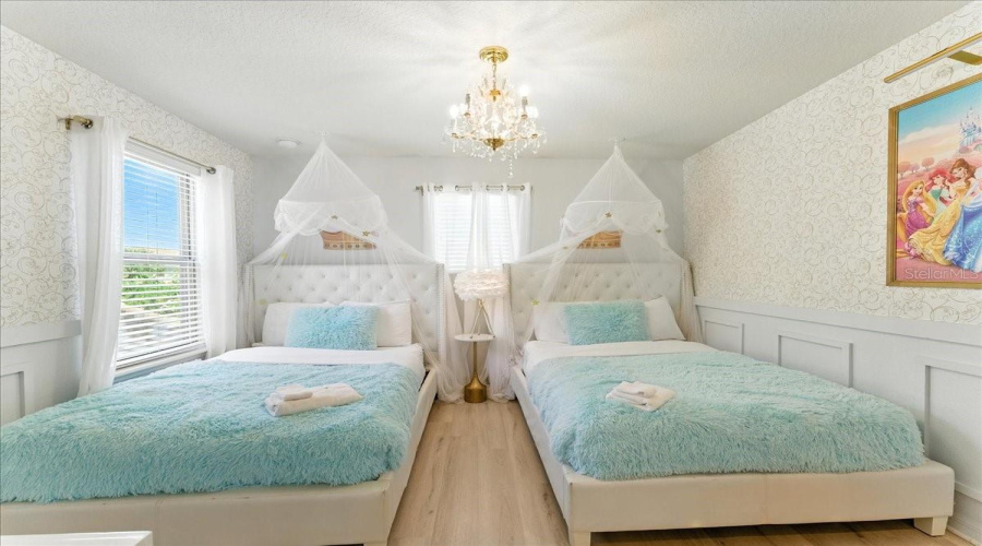 Chandelier glow, fluffy throws, and twin beds they’ll race to call.