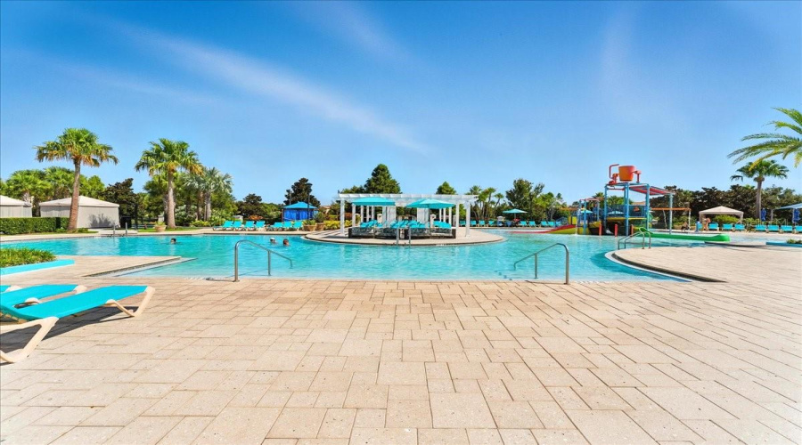 Resort pool with an island of loungers—because sometimes the best seat is in the middle of it all.