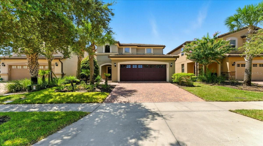 Palm trees out front, poolside paradise out back — this is your vacation home base.