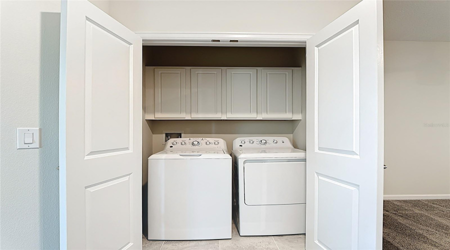 laundry closet - second floor -  with built-in cabinetry