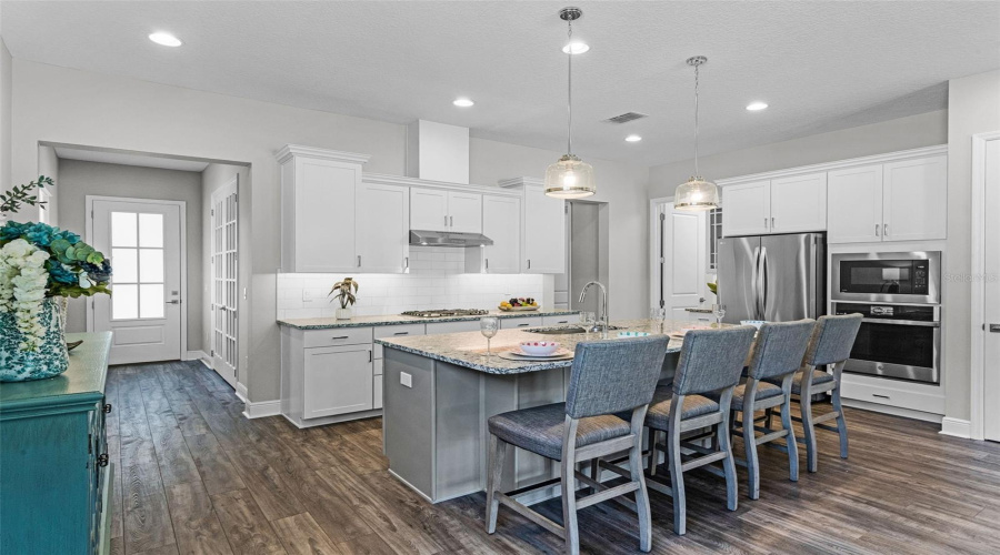 Updated chef's kitchen with stainless steel appliances and gas cooktop