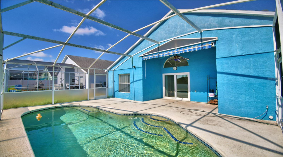 Swimming pool and patio. Entry to the patio and pool can be obtained from the primary bath, or from the living room slider.