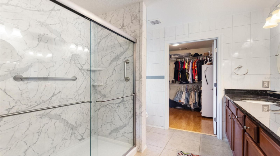 Updates shower and large walk-in closet in primary bath