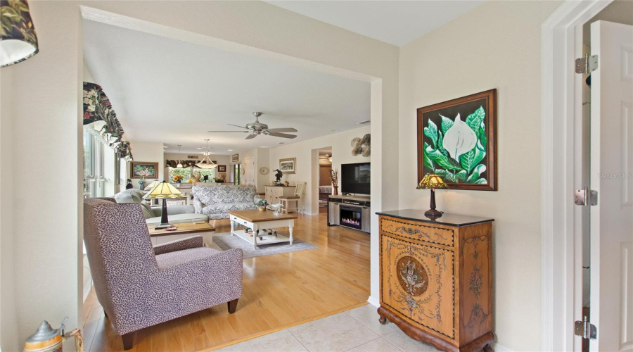 Entry foyer has entrance to front bedroom on right