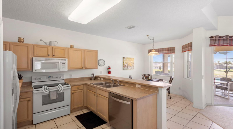 Eat-in Kitchen overlooking the pool