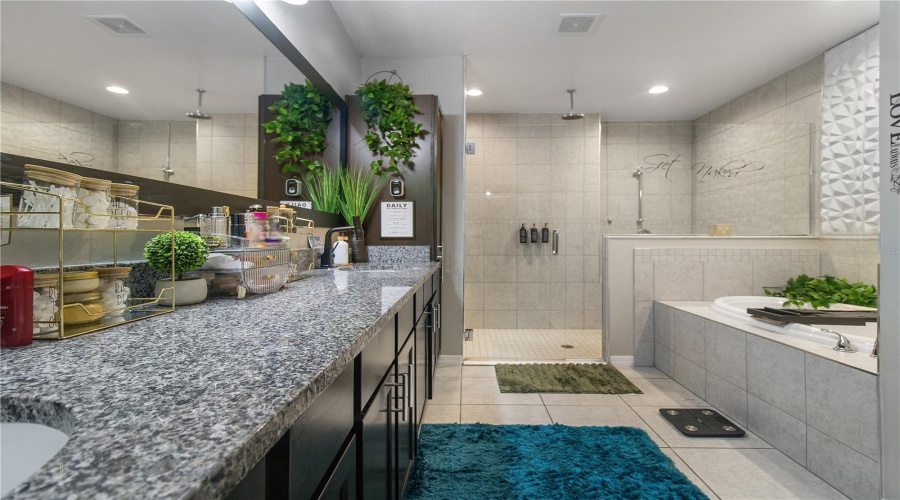 His and her sinks, spa style bathtub, and a walk in shower... what's not to love!